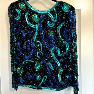 Vintage sequined top by Stenay. Size L. 100% silk lined. Zips up. 25in